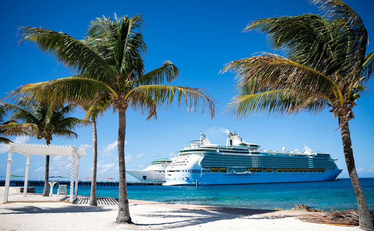 Cruise ship beside a tropical island
